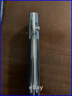 Andre Thorburn Model L19 Custom Knife. Carbon Fiber Red Liner Anodized Titanium