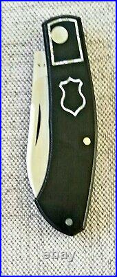 Meades Mini Dino Custom Knife, 3.625. Black Micarta. Silver Twill FC skeletons