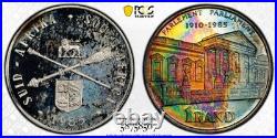 PR66CAM 1985 South Africa Silver Proof Rand, PCGS Trueview- VIVID Rainbow Toned